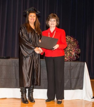 Irene Ensley of Fannin County spent 12 years working to earn her GED. Here she finally receives it from NGTC President, Dr. Gail Thaxton, during graduation ceremonies on Oct. 16.