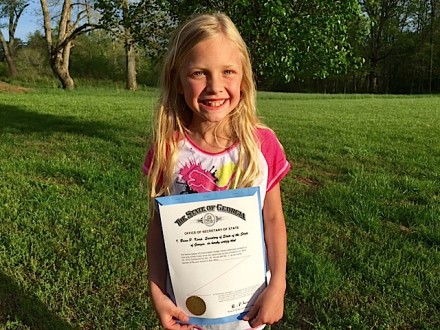 news-living-ava fowler with personal, signed copy of HB1