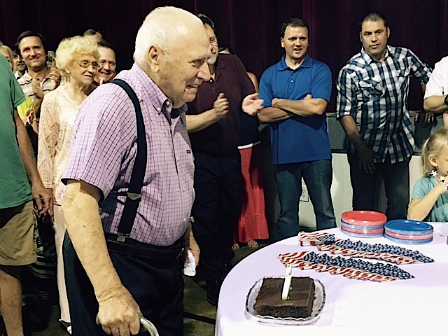 Comer Rudeseal can blow out 3 candles on this cake or 100 on the other one