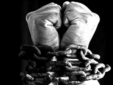 hands-bound-with-chains-photograph