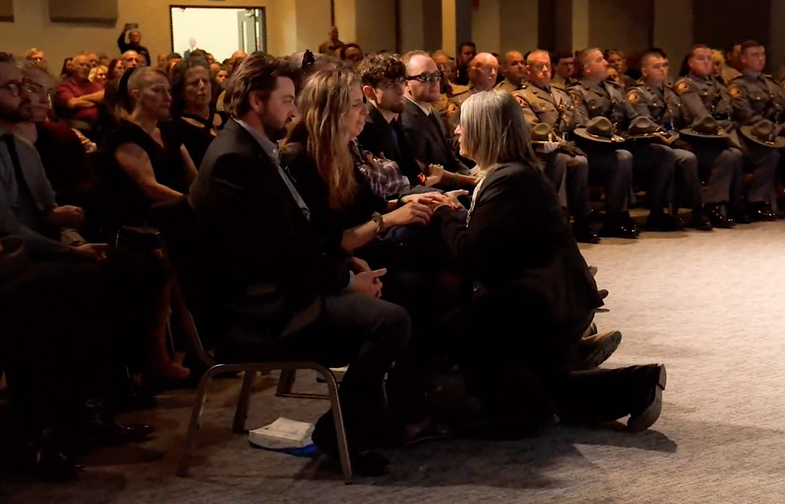 Sheriff Mangum presents the coffin flag to Deputy Marshall's family