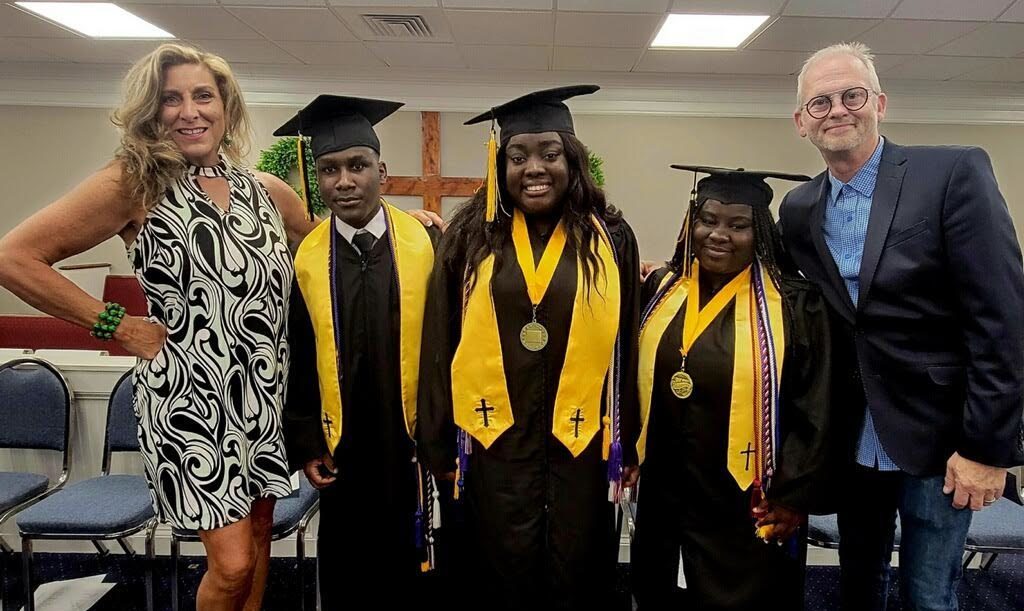 Haitian half-sisters graduate