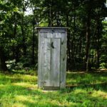 Between the outhouse and the cherry tree