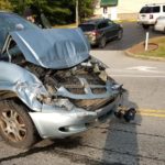 Driver charged in rear-end wreck involving school bus