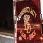 Vehicle catches fire, flames extend to nearby residence