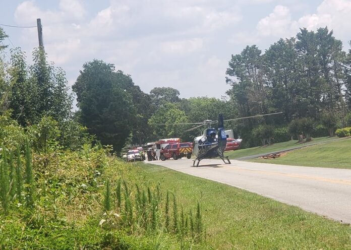 AirLife helicopter at scene of farm equipment accident in White County