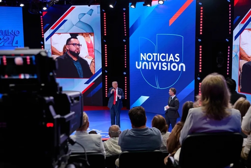 Trump courts Latino voters at Univision town hall, and Harris ventures ...