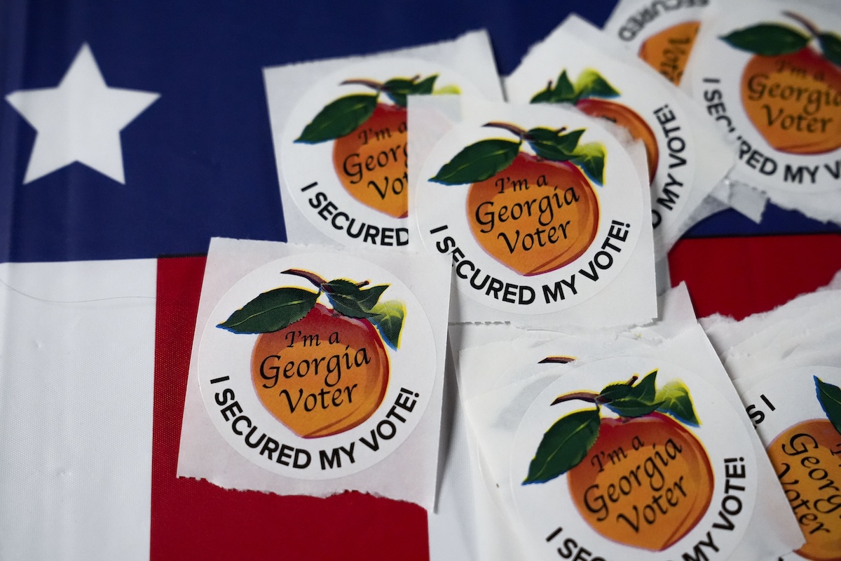 Georgia mayor and 2 others are jailed on felony charges for trying to halt a local election