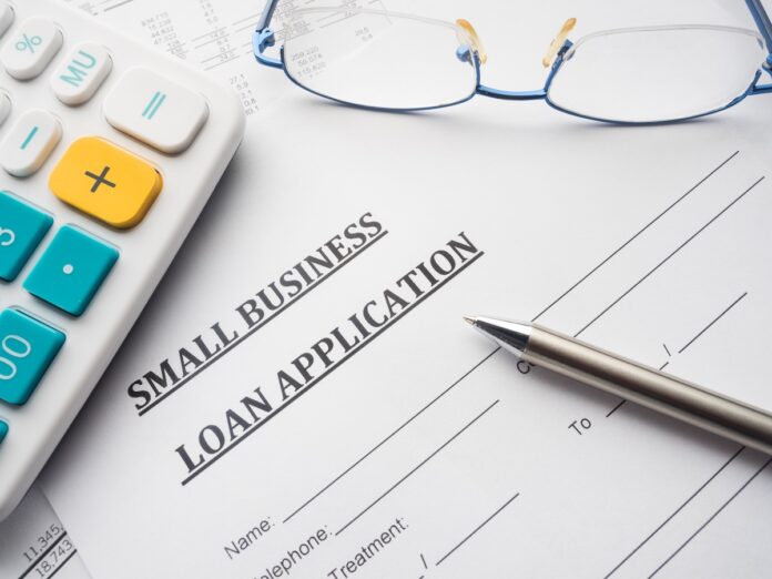 small business loan application on the desk.