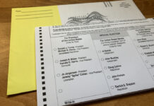 Trump signs order seeking to curb vote-by-mail