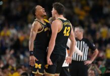 Michigan rolls to national title game with win over Arizona