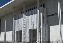 Kennedy Center facade blocked from public view by tarp after Trump’s name removed