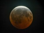 Near-total lunar eclipse dazzles skywatchers across the Americas and Europe