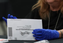 Why the rushed Postal Service plan for mail-in voting has states in a panic