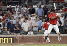 Braves outlast Phillies 6-5 in 11 innings in opener of key NL East series