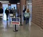 Suit challenges Trump administration move to allow some ICE presence at polling places