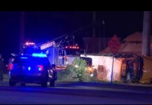 School bus carrying football players overturns, injuring dozens